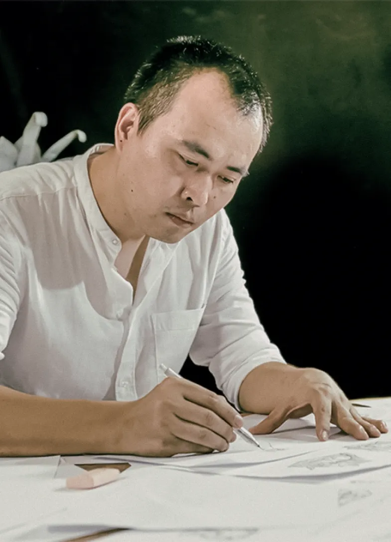 Designer works at his desk